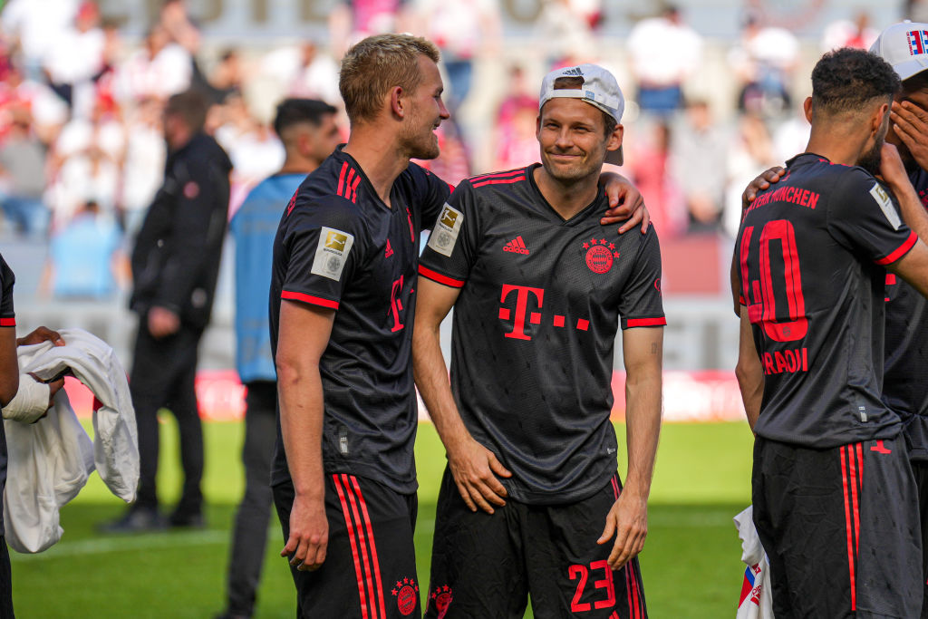: Matthijs de Ligt of FC Bayern Munchen and Daley Blind of FC Bayern Munchen celebrate after the Bundesliga match between 1. FC Koln and FC Bayern Munchen