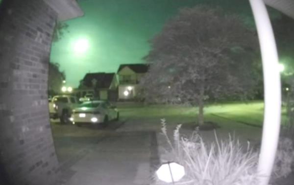 The bright green fireball filmed on a doorbell camera.